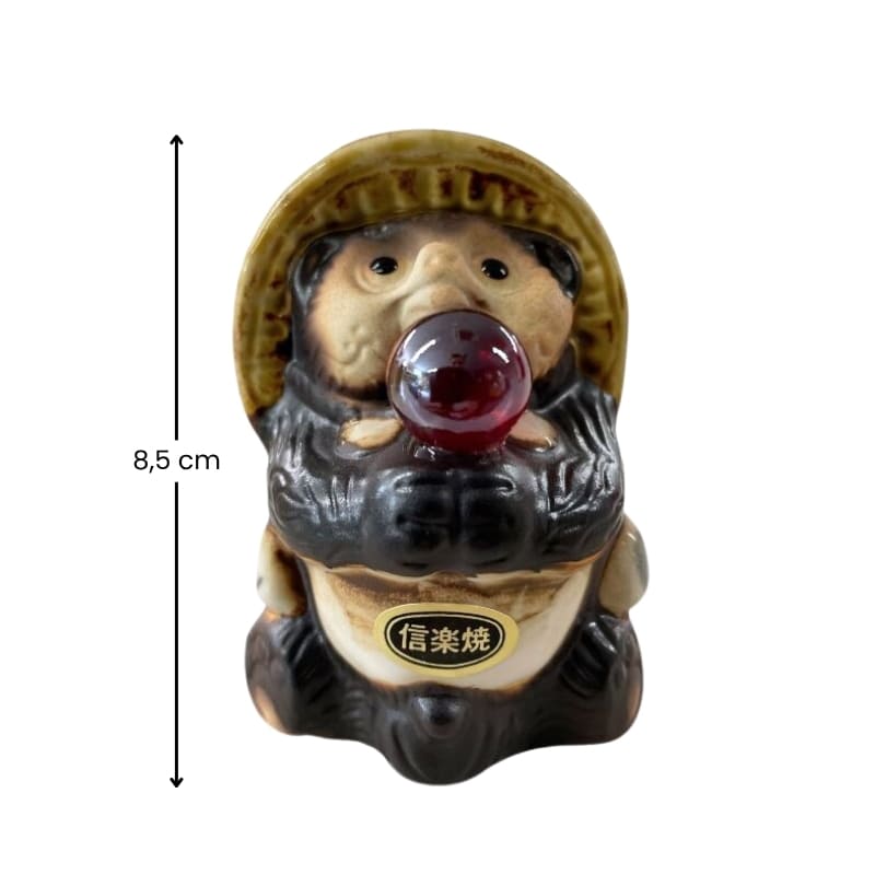 Statue Tanuki Rote Perle